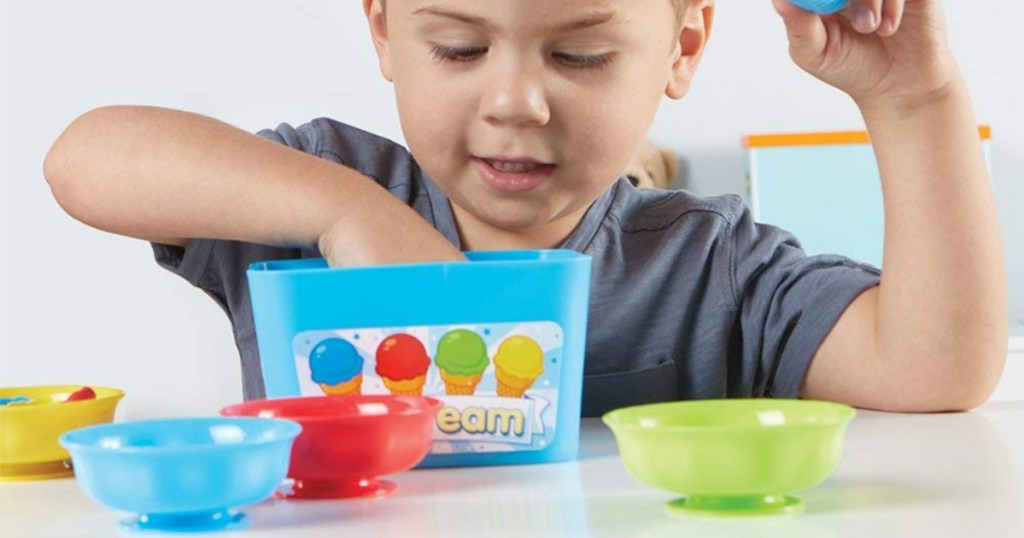 boy playing with smart scoops set