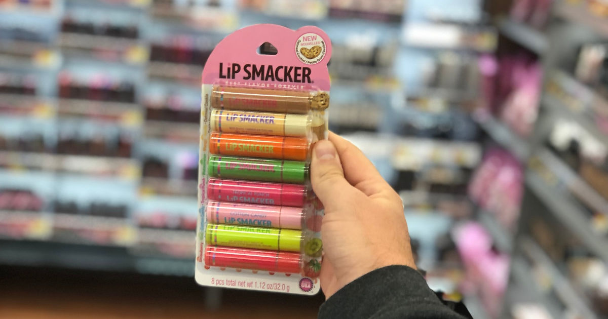 handing holding up lip smackers party pack