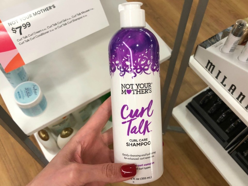 Not Your Mother's Curl Talk Curl Care Shampoo in hand in ULTA Beauty store