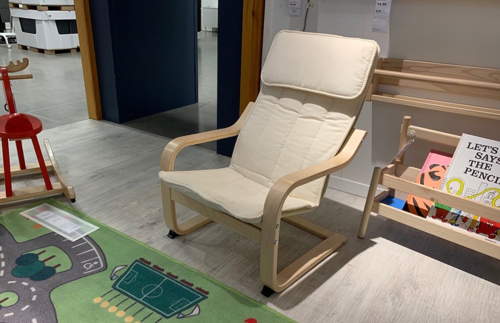 white and wood kids armchair sitting in IKEA play room