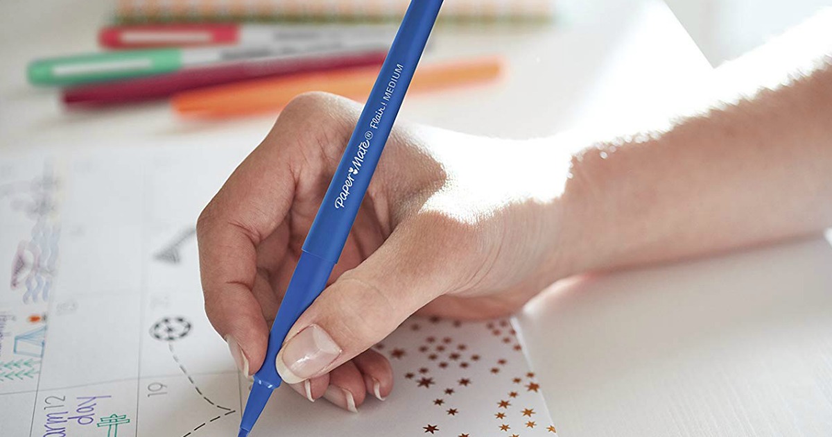 hand using a felt tip pen to write