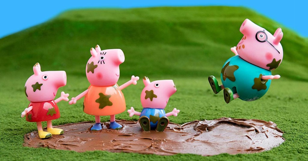 Peppa Pigs family playing in muddy puddles