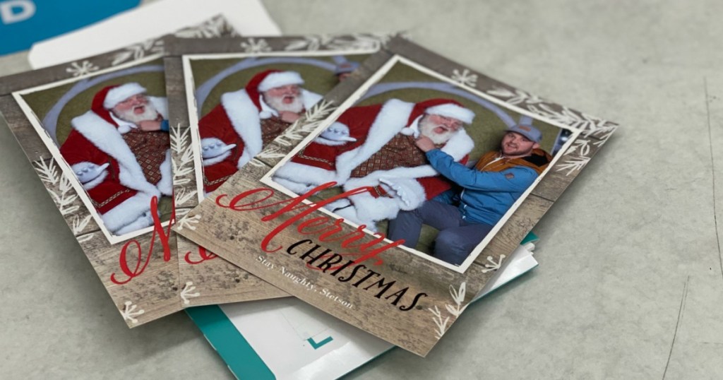 Christmas cards featuring a man on Santa's lap