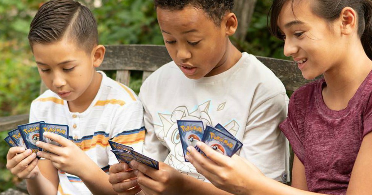 kids playing with Pokemon Cards