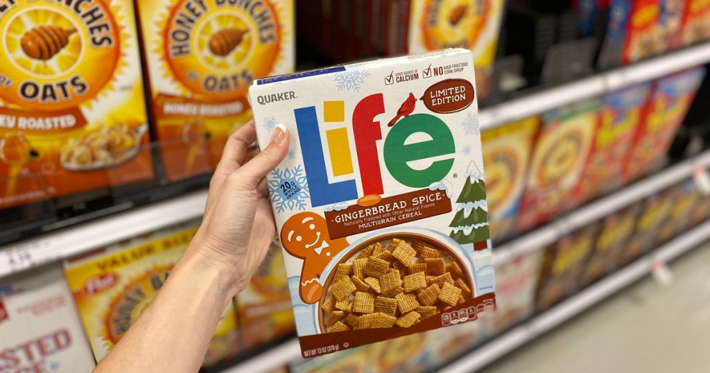 hand holding up box of quaker life gingerbread spice cereal