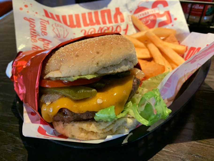 Red Robin Burger in basket with fries on table in restaurant