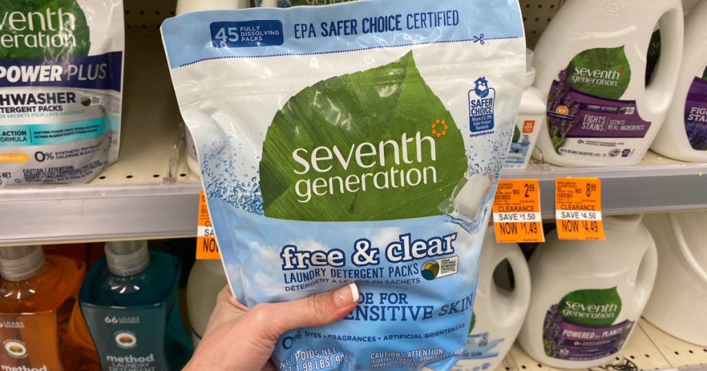 hand holding up seventh generation detergent at walgreens