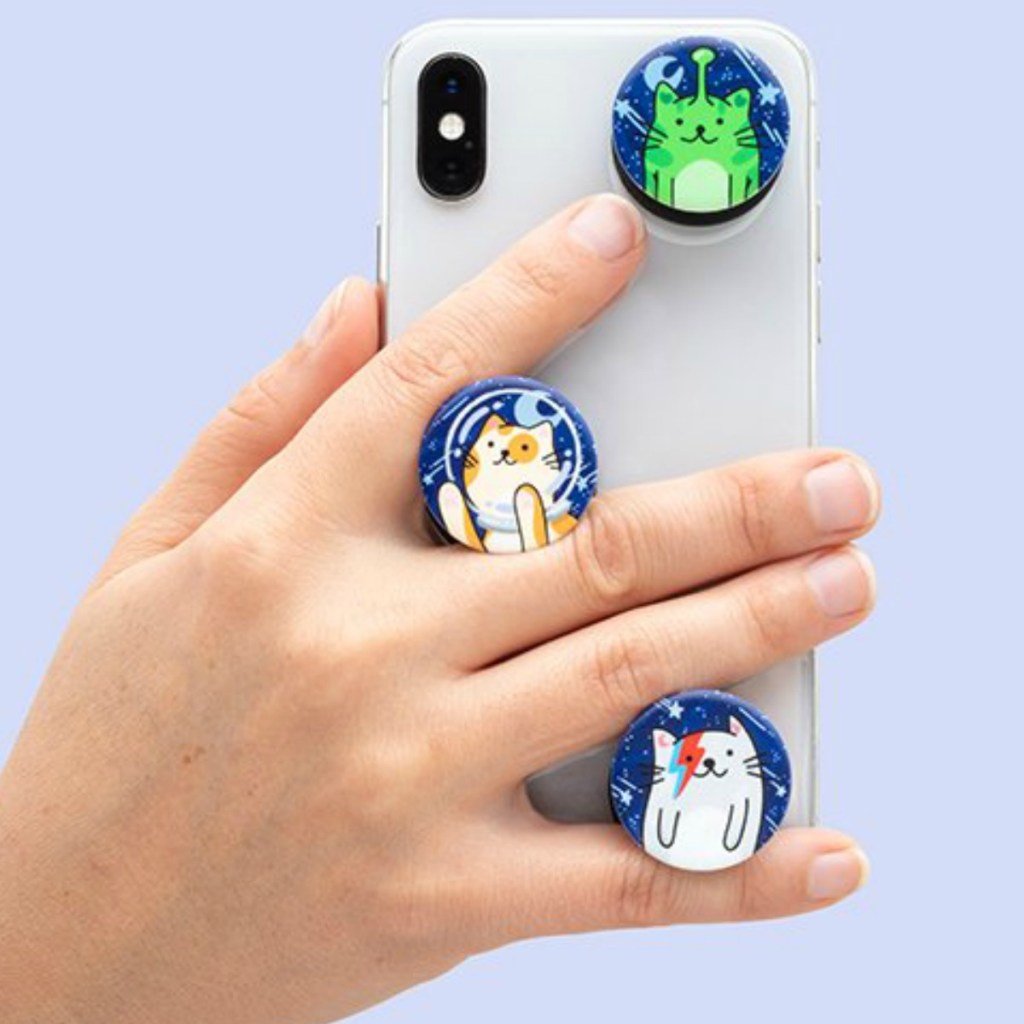 Phone with three cat-themed mini popsockets