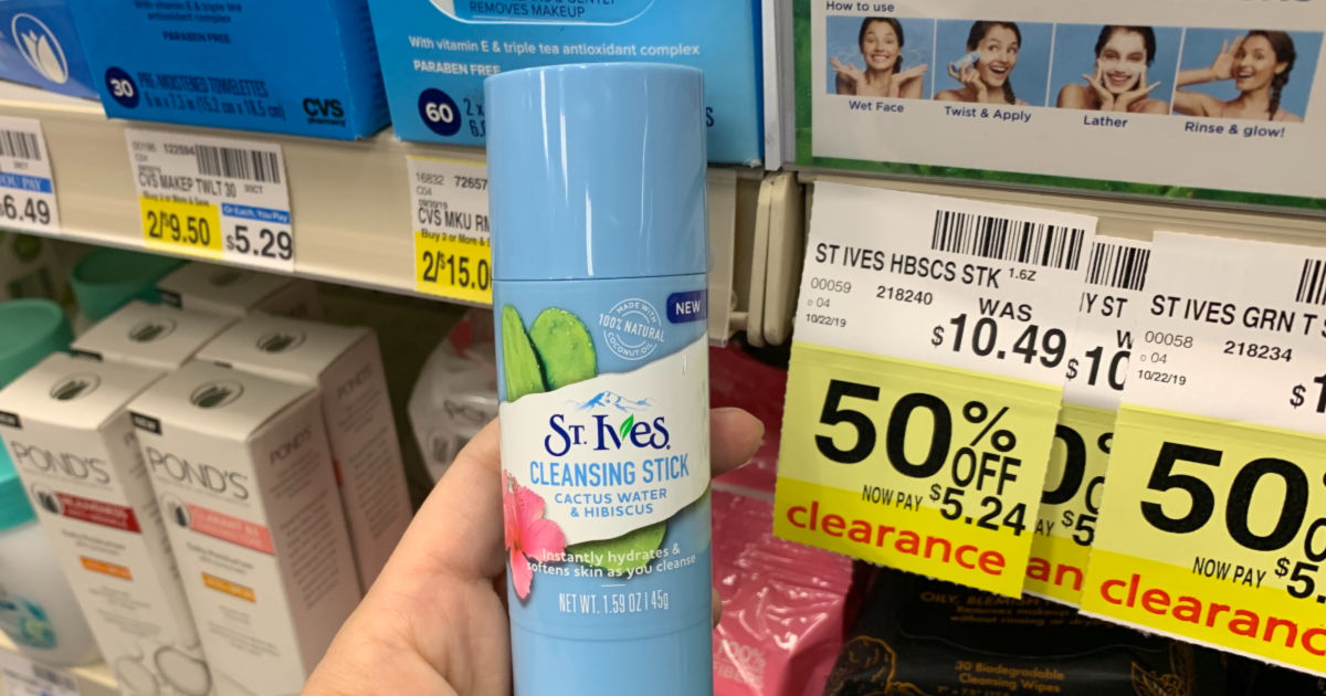 Hand holding St. Ives cleansing stick 