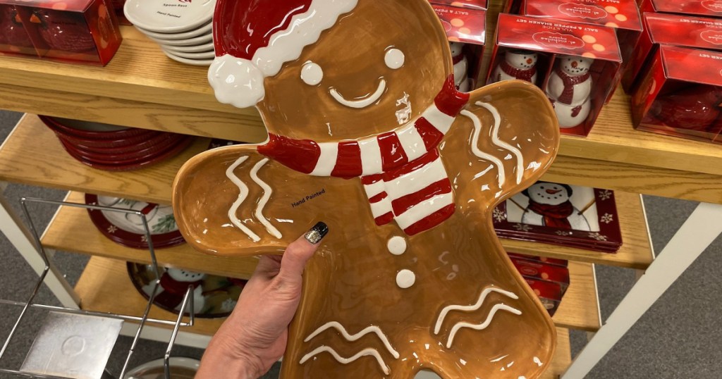 hand holding up gingerbread serving platter 
