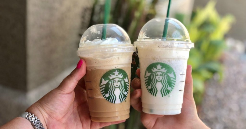 Two Starbucks Frappuccino beverages in hand