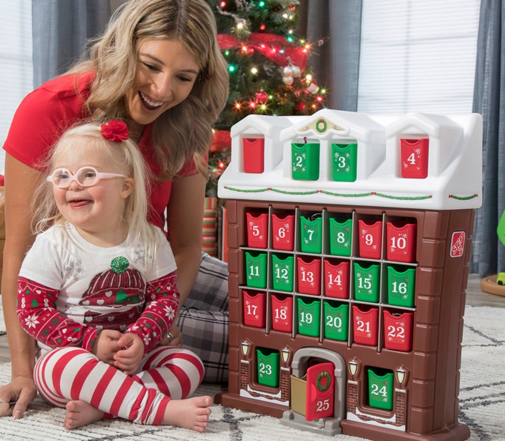 woman and little girl playing with Step2 advent calendar for kids
