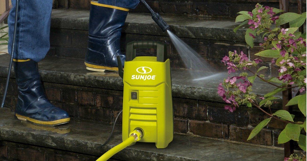 man using Sun Joe Electric Pressure Washer on his steps