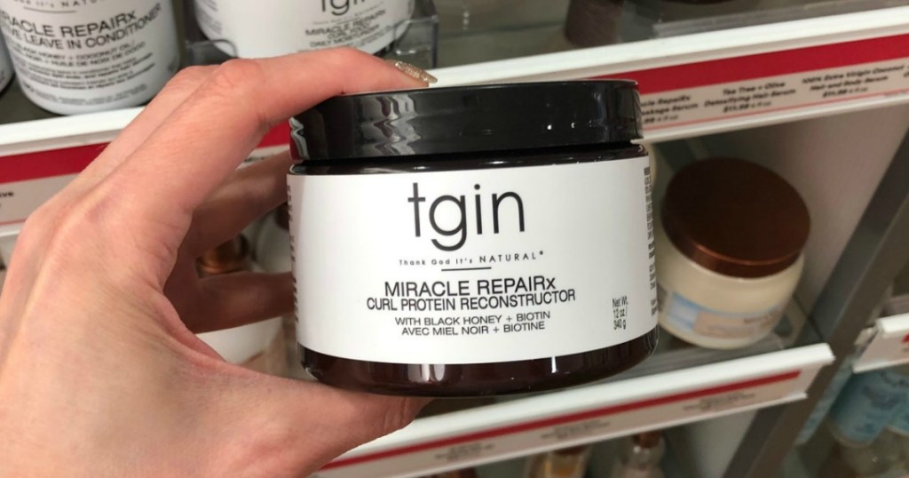 Hand holding jar of tgin Miracle REPAIRx in ULTA
