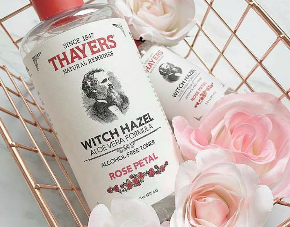 Thayers Rose Petal Toner in rose gold basket with pink roses