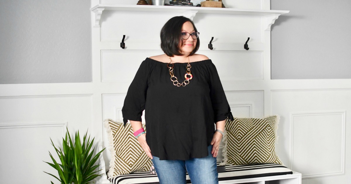 woman wearing amazon off the shoulder black blouse top