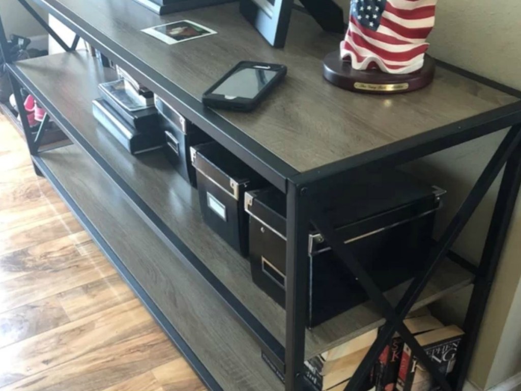 Tv stand with objects on it on hardwood livingroom floor