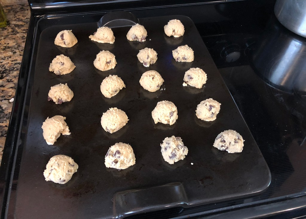 Cookie dough balls on baking stone