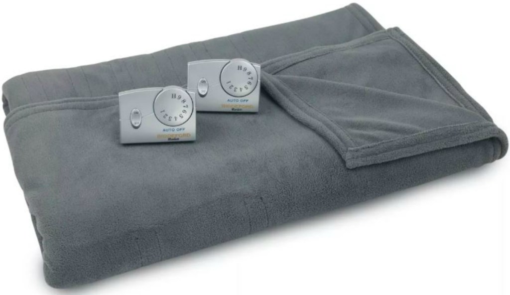 grey blanket with two electric controllers on it