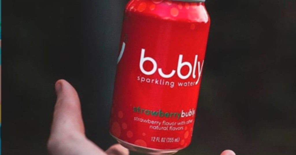 hand holding can of strawberry bubly
