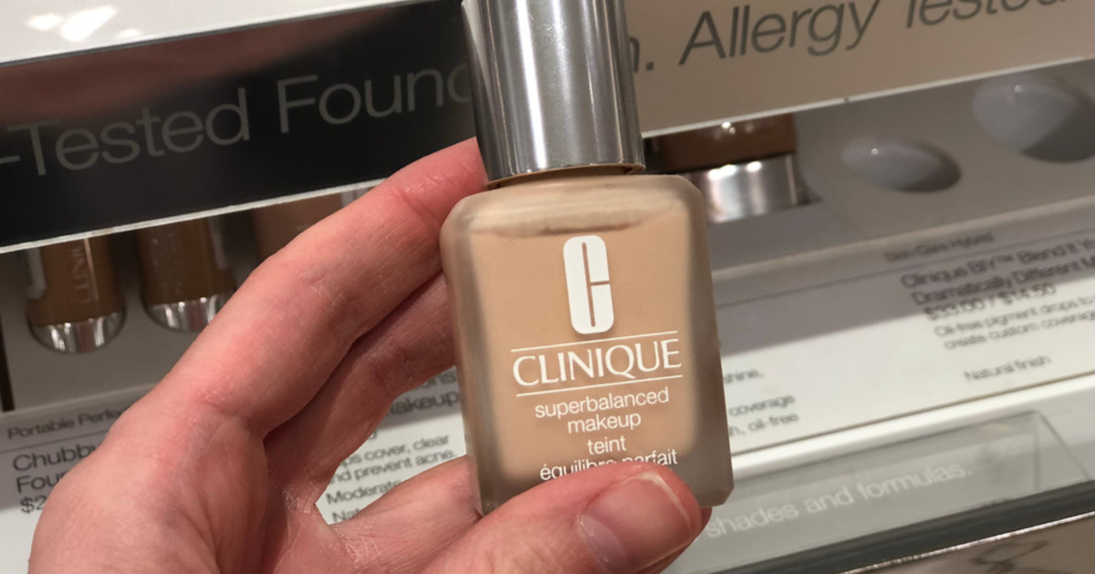 hand holding clinique foundation in store