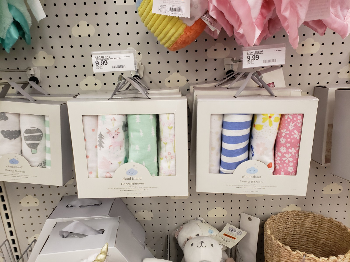 cloud island baby blankets hanging in store