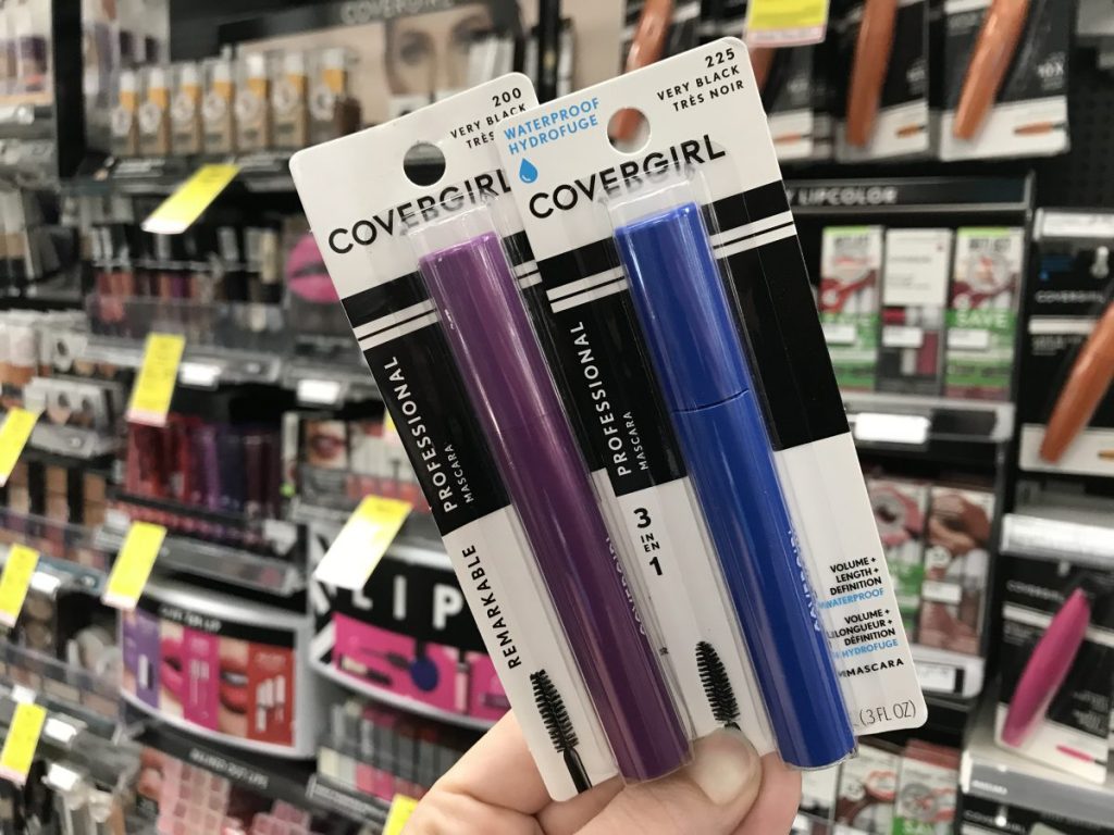 hand holding two CoverGirl Mascara packages at CVS