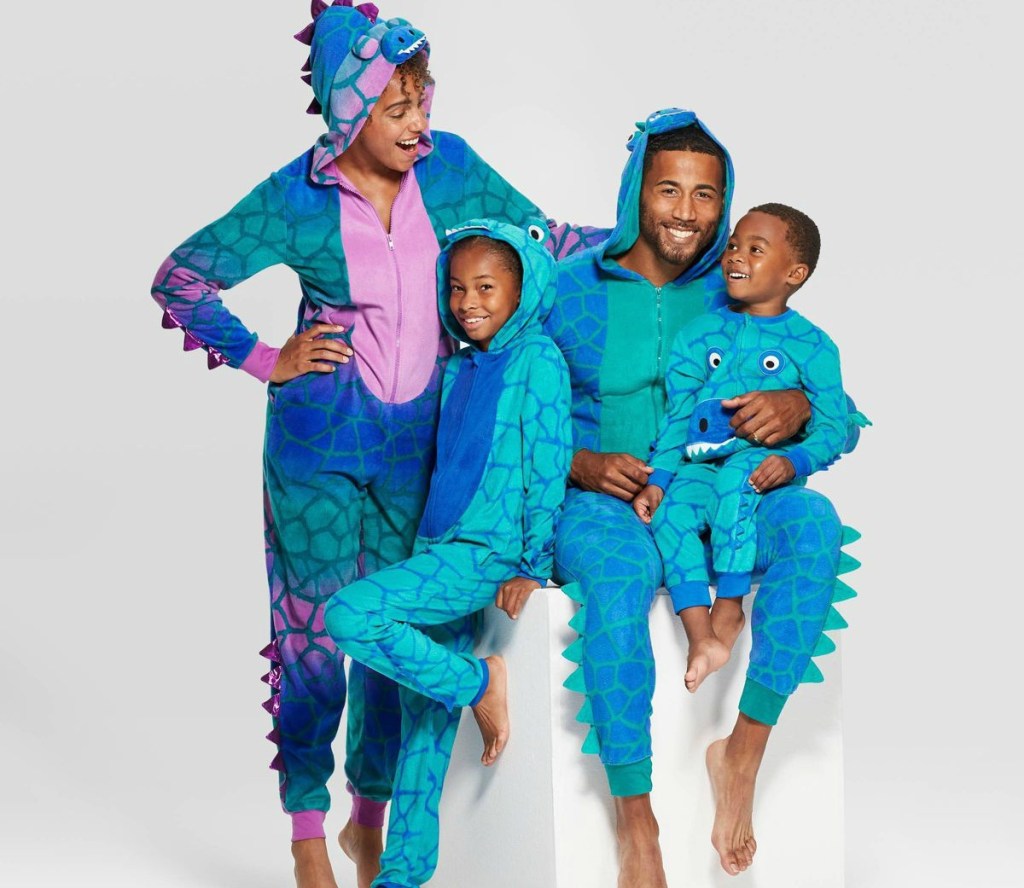 family wearing dinosaur union suits