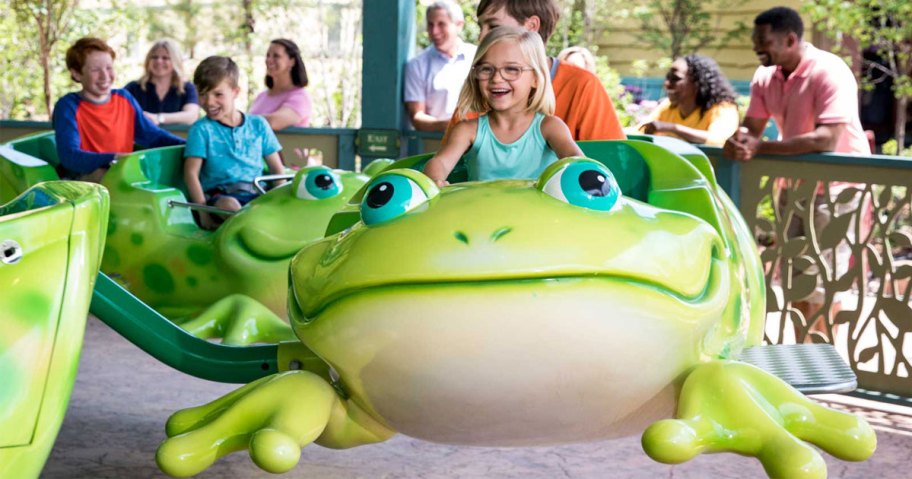 girl riding on frog ride 