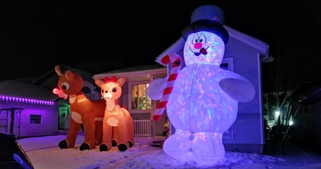 huge inflatables on snowy yard