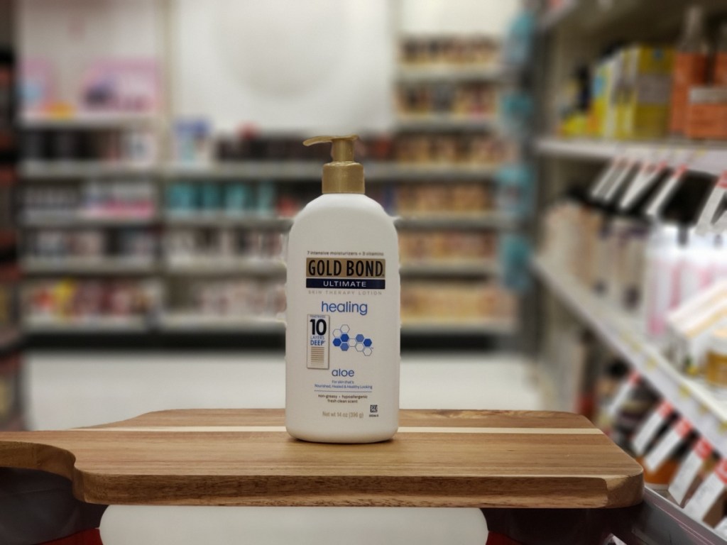 gold bond healing lotion on cutting board in store with blurred background