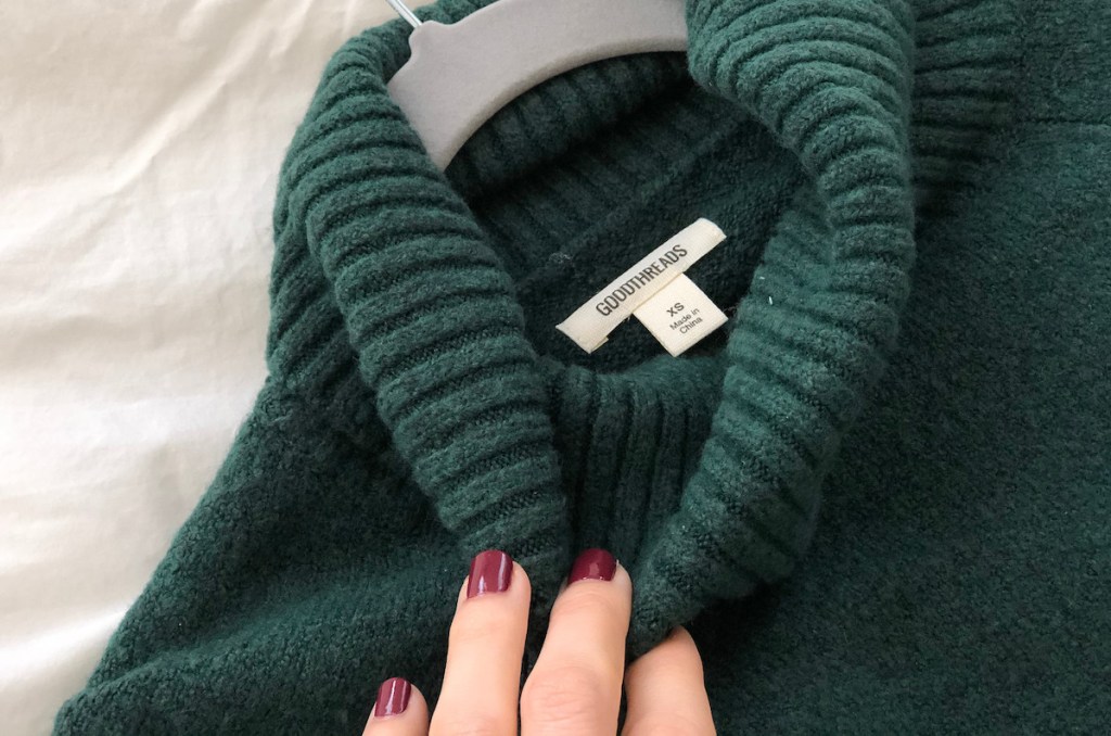 close up of emerald green turtleneck and goodthreads amazon tag