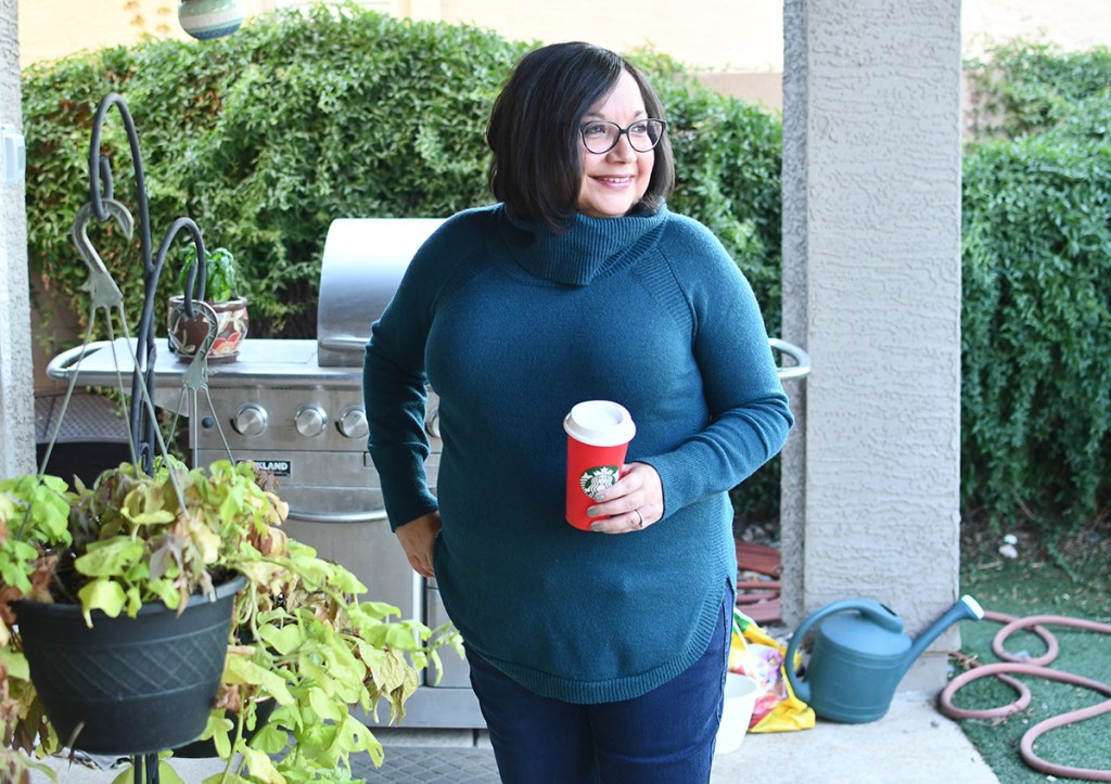 Woman wearing Time and Tru cowl neck sweater