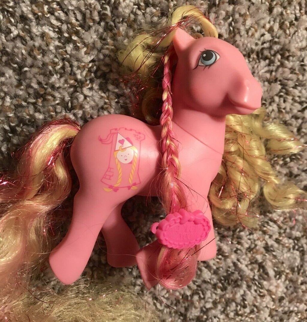 pink my little pony horse toy on carpet