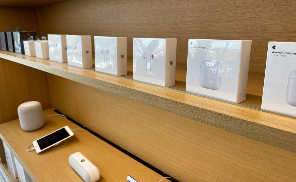 new apple products in boxes on shelf in store