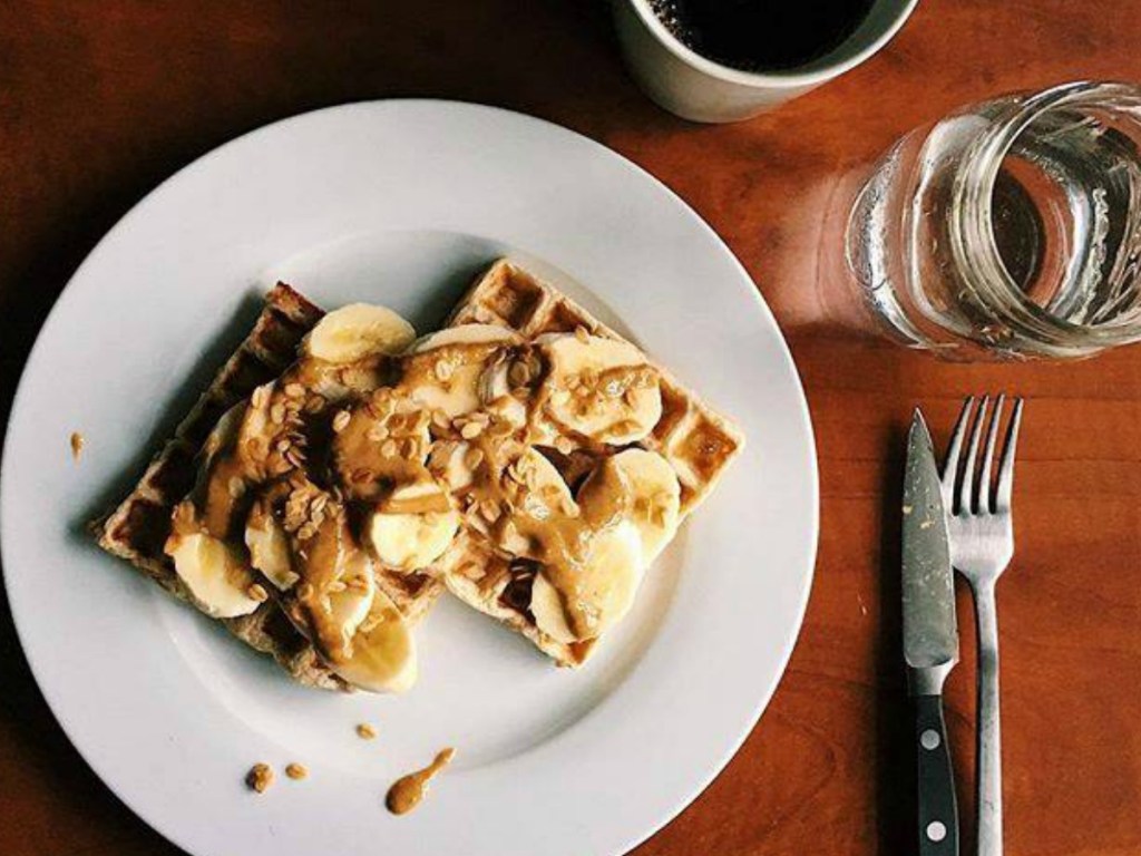 plate with toast topped with bananas and peanut butter