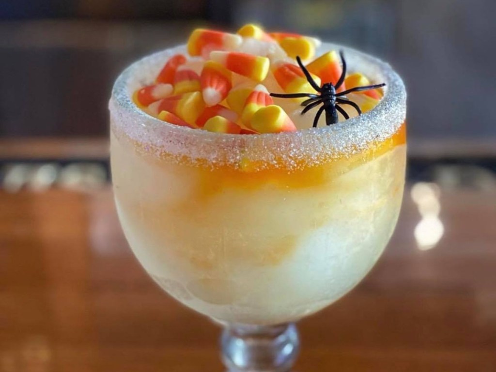 frozen drink with candy corn and spider ring on top