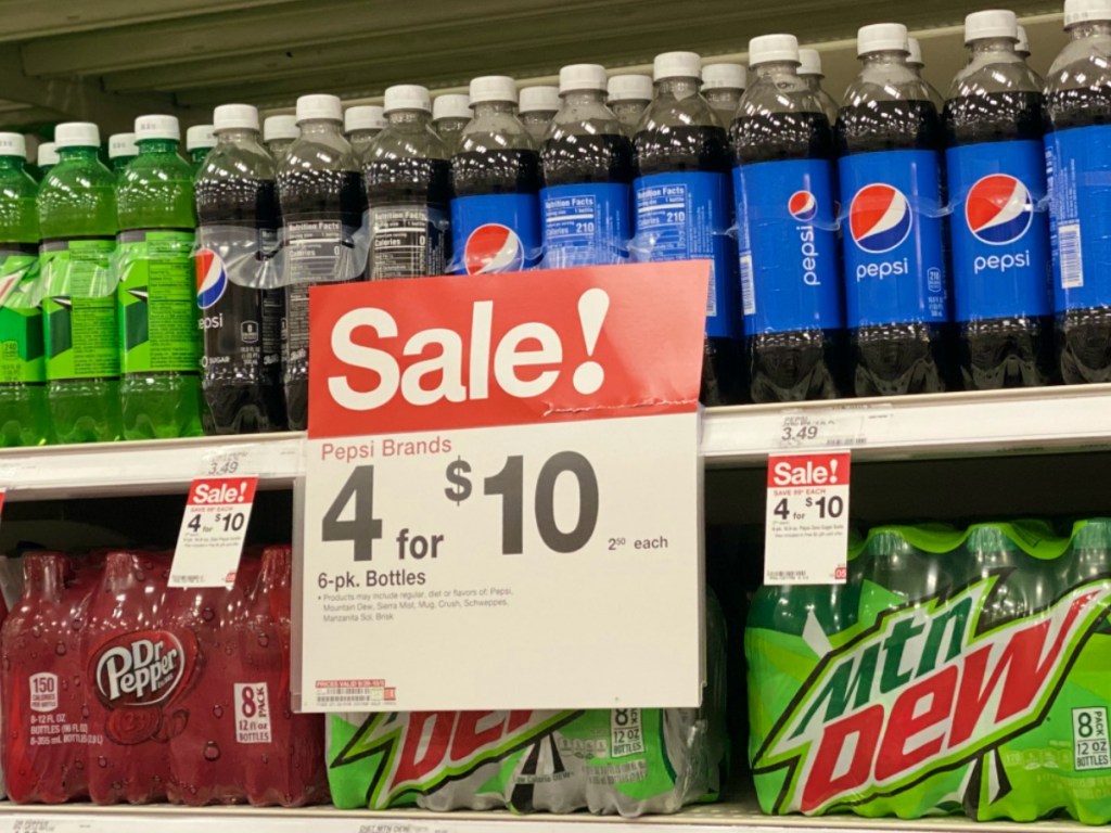 pepsi brand soda in bottles on store shelf with price tag