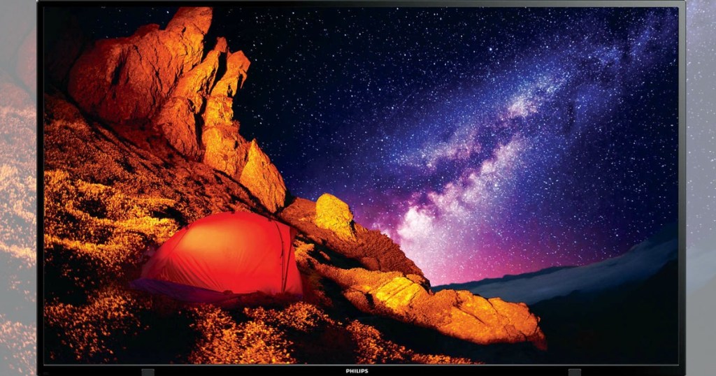 tv with picture of rocks and ocean at night