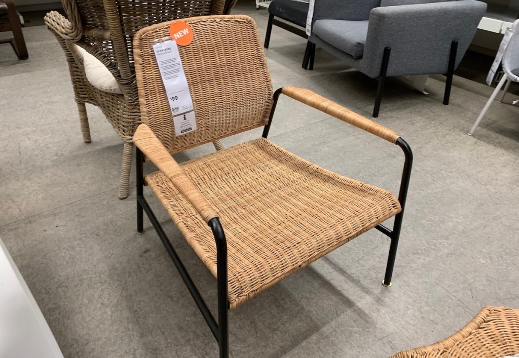 brown and black rattan chair sitting on IKEA store floor