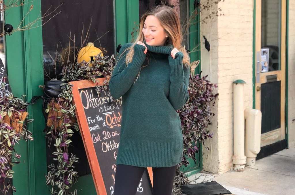 woman wearing green sweater outside 