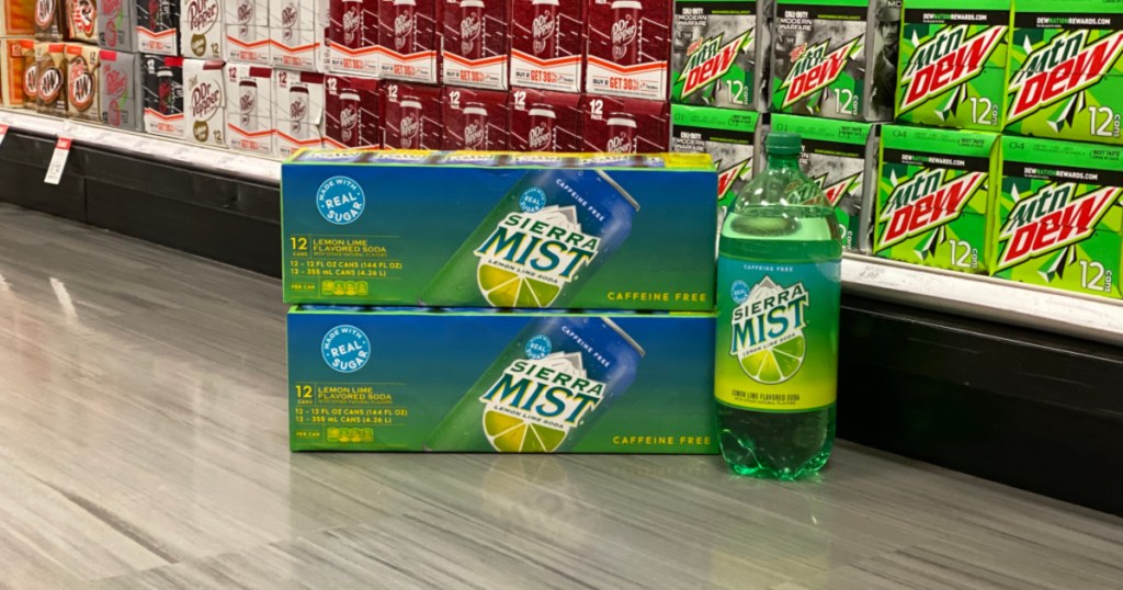 two sierra mist 12-packs and sierra mist 2-liter bottle on store floor in soda aisle