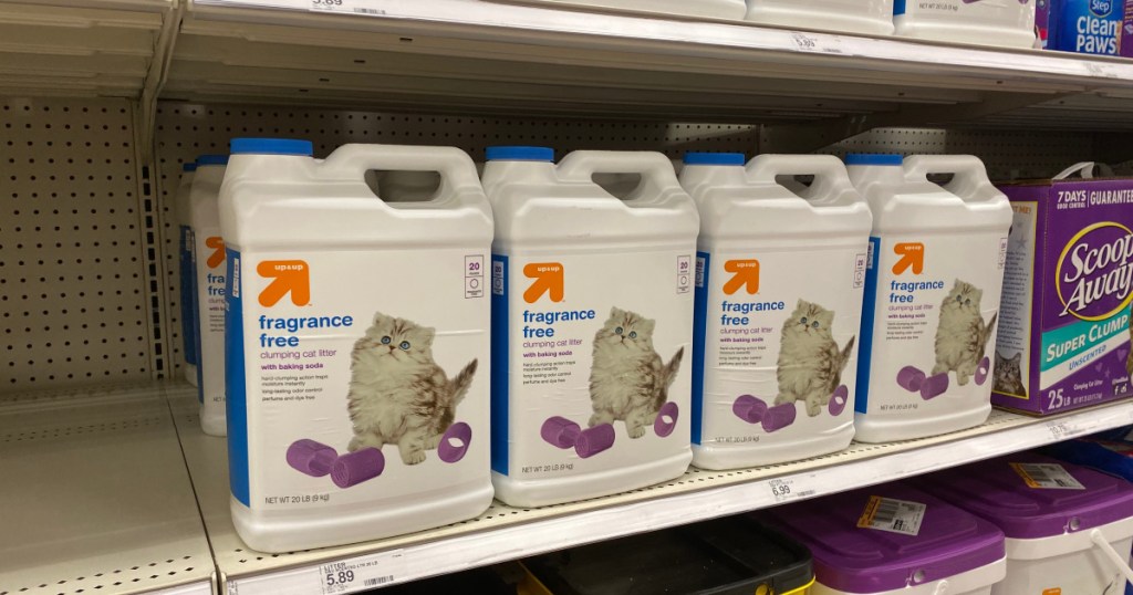 white containers with cat litter on shelf 