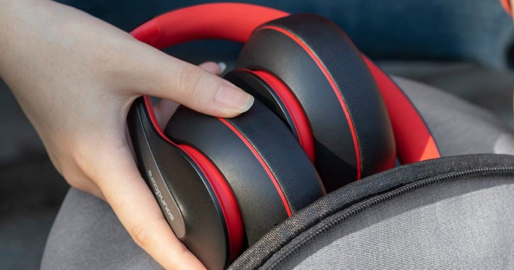 Anker Soundcore Life Bluetooth Headphones in hand going into bag