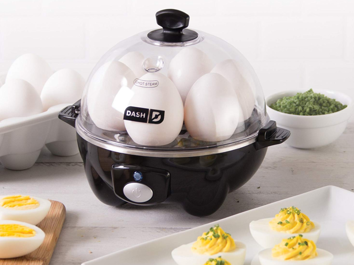 Black Dash Egg cooker with eggs inside and deviled eggs on counter