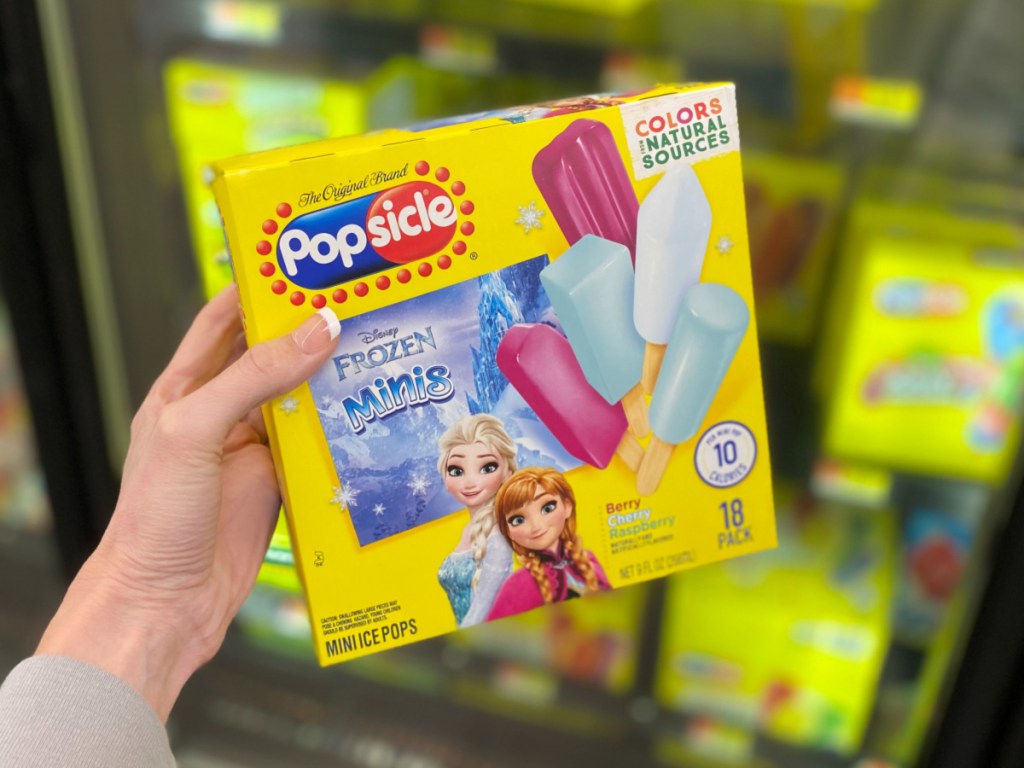 hand holding Frozen Popsicles at Walmart 