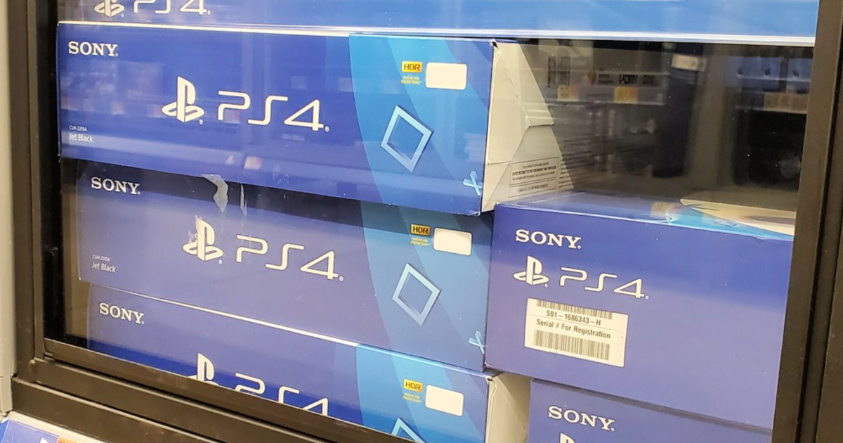 boxes of sony ps4 stacked in glass case