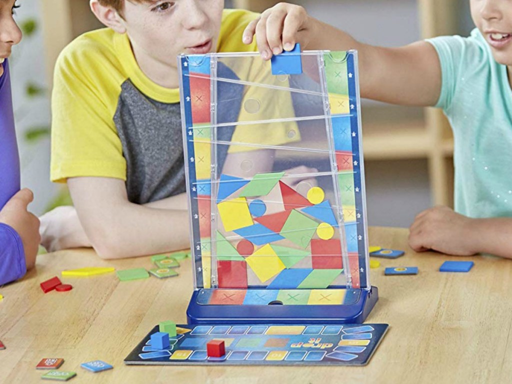 Kids playing a board game on a table