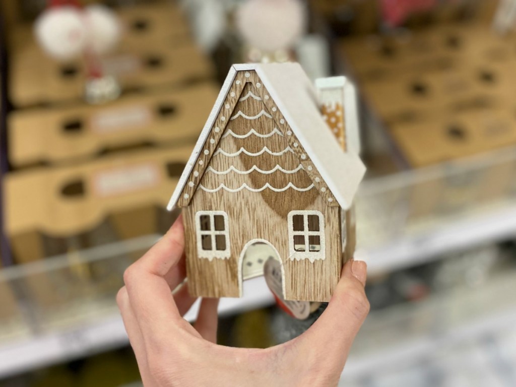 Hand holding gingerbread decor in Target