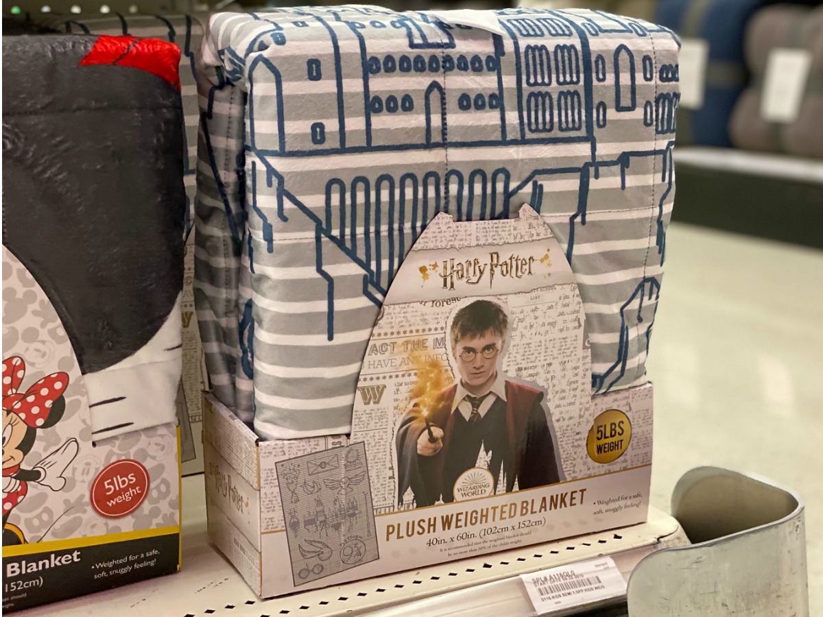 Harry Potter themed weighted blanket in package on shelf in Target